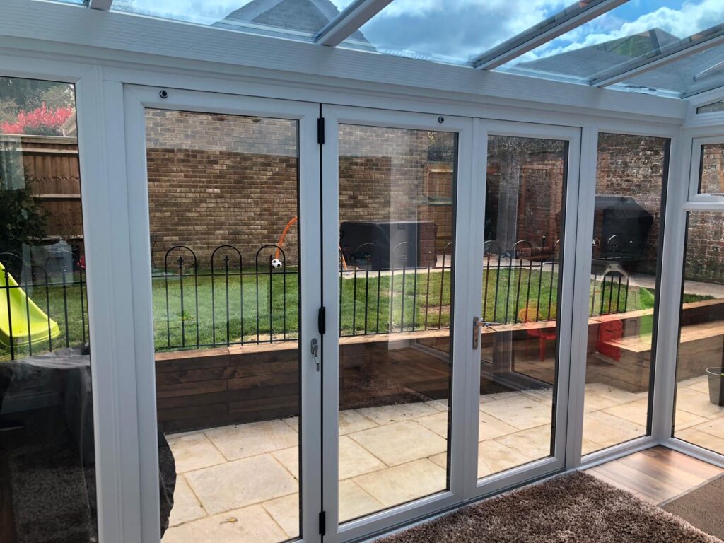 Interior view of a conservatory with solar control window film installed on the roof and windows to improve comfort during warmer weather.